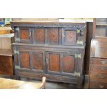 A 17th Century moulded oak Court Cupboard, the upper section with fitted pair of inlaid cupboard
