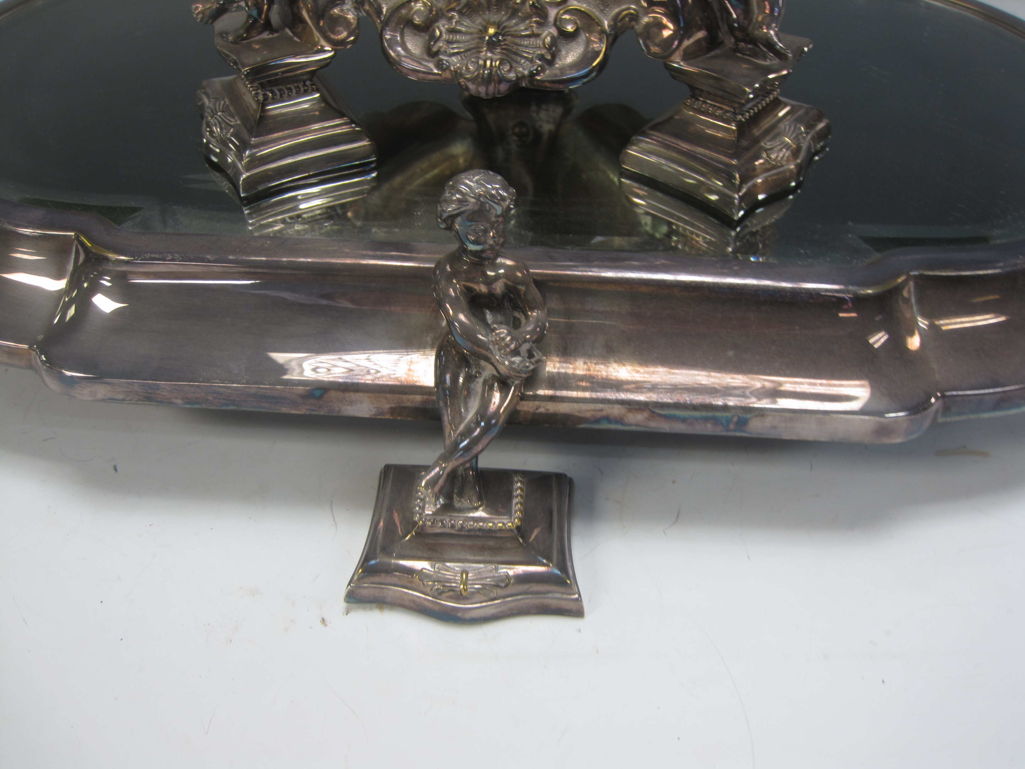 A Victorian plated Epergne with platform base having bevelled mirror and cherub supports, baluster - Image 2 of 3