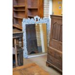 An antique fruiting vine carved and white painted Wall Mirror, 4ft 7in H x 3ft 5in W