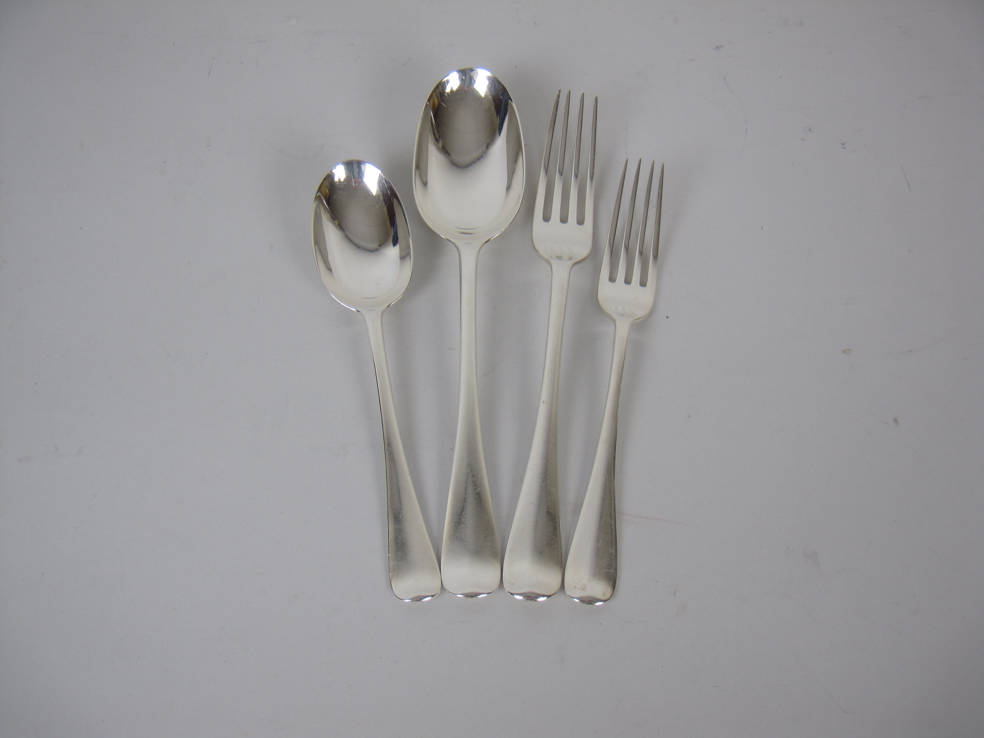 A Set of Edward VII silver Cutlery for eight places, Hanoverian with rat tail bowls engraved fox