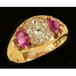 An early 20th Century Diamond and Ruby Ring pavé-set old-cut diamond within ten smaller old-cut