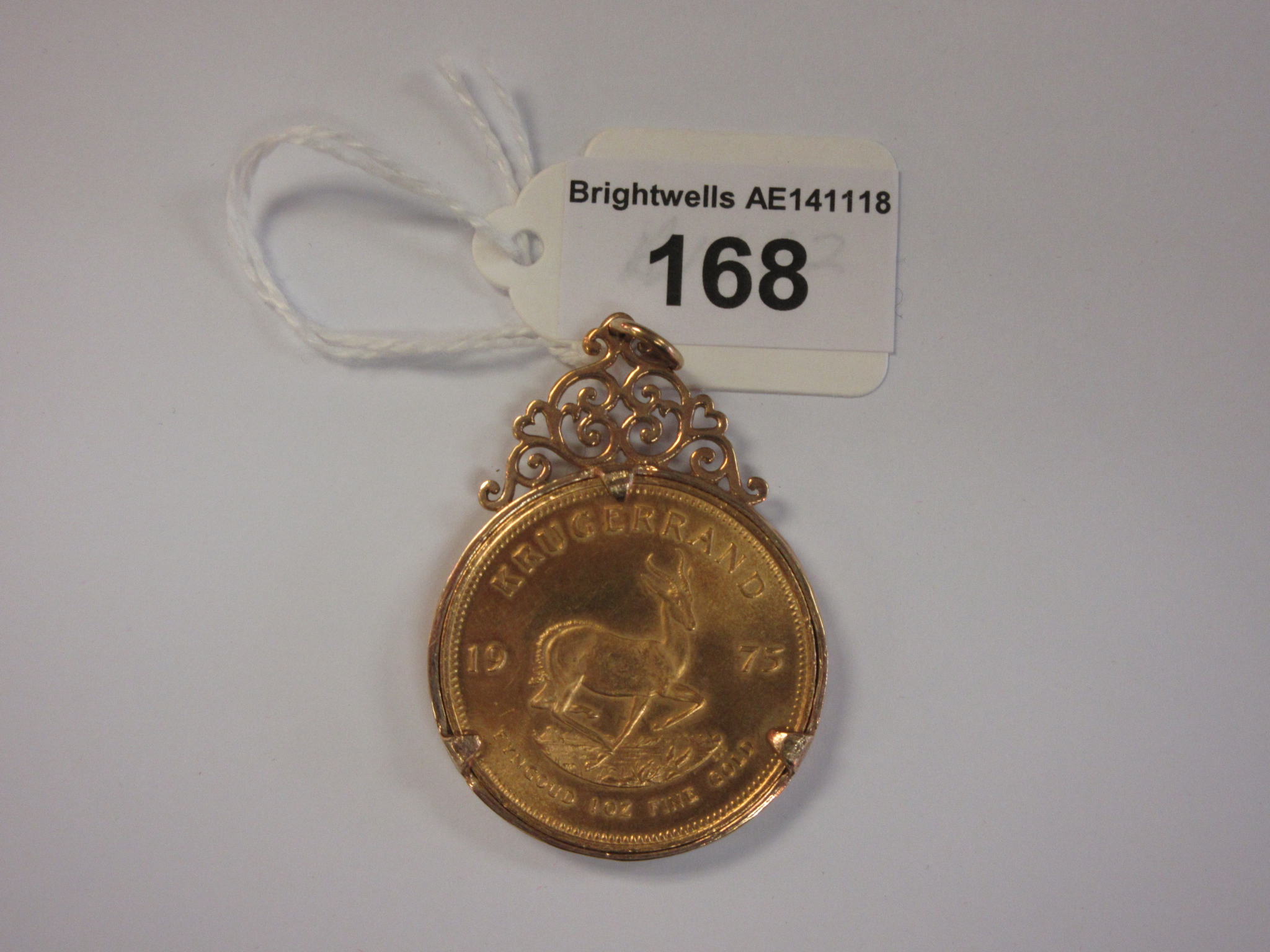 A 1975 Krugerrand in 9ct gold pendant mount, approx 40gms all in