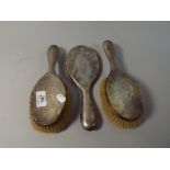 A Silver Dressing Table Set Comprising of Two Brushes and A Mirror