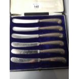A Cased Set of Silver Handled Pistol Grip Butter Knives