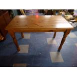 A Rectangular Pine Kitchen Table