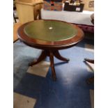 A Circular Tooled Leather Topped Mahogany Coffee Table,