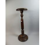 A Turned Stained Pine Torchere Stand,