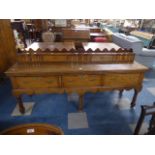 A Nice Quality Crossbanded Oak Dresser with Three Drawers Having Pierced Brass Handles and