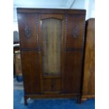 An Edwardian Oak Double Wardrobe