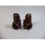 A Pair of Carved Colonial Hardwood Studies of Lions with Shields,