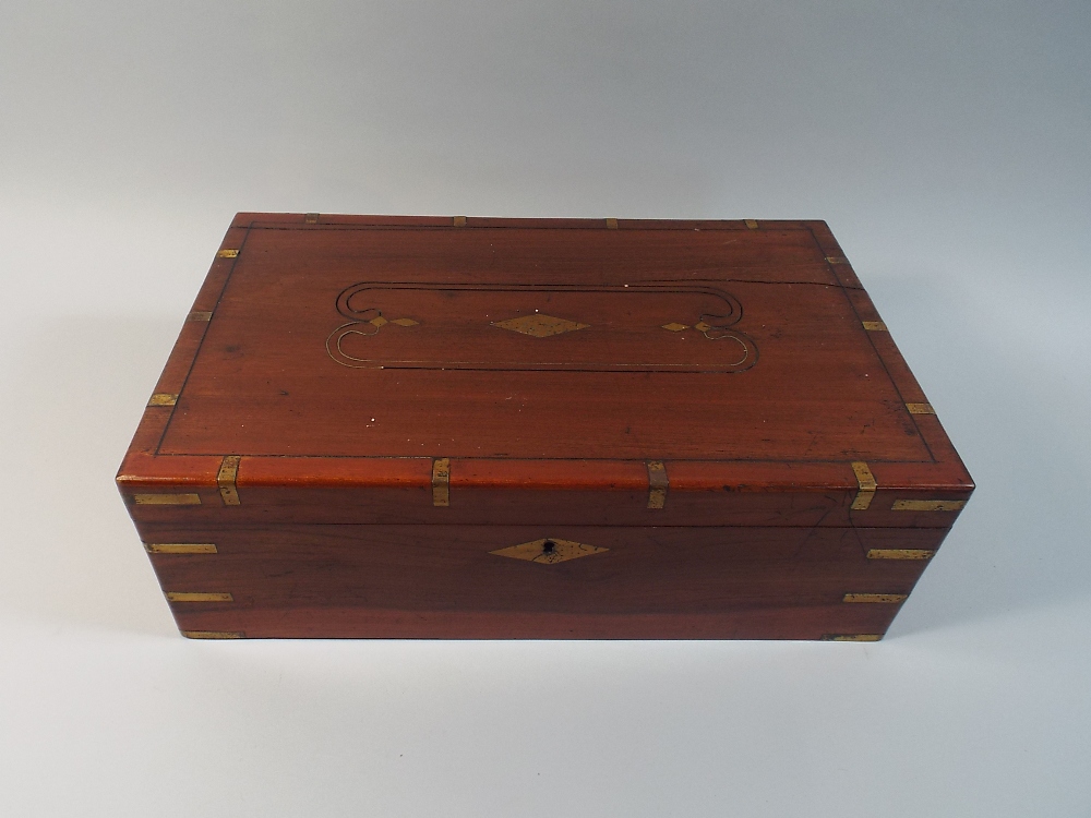 A Colonial Brass Inlaid Writing Slope with Fitted Interior,