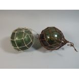 A Pair of Green Glass Fishing Floats