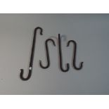 A Collection of Four Iron S Hooks