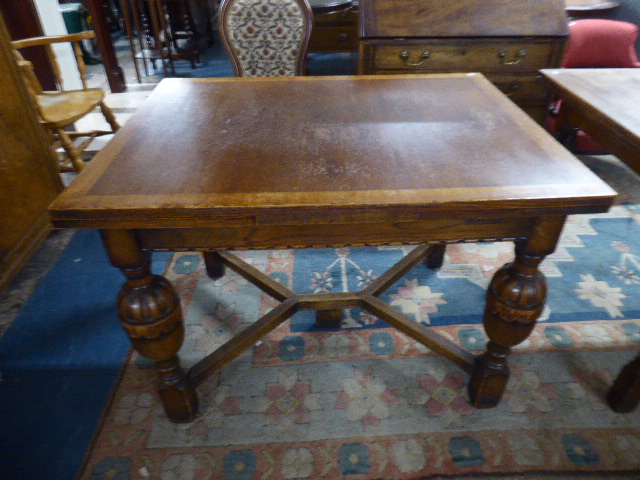 A Drawer Leaf Oak Dining Table on Carved Bulbous Supports,
