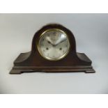 An Edwardian Oak Mantle Clock for Bravingtons Limited,