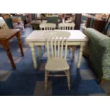 A Painted Pine Rectangular Kitchen Table and Three Chairs