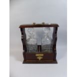 A Presentation Two Bottle Mahogany Tantalus with Brass Mounts, British Racing and Sports Car Club,