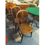 A Pair of Wheel Back Elm Seated Kitchen Chairs