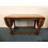 An Oak Drop Leaf Coffee Table on Turned Supports,