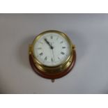 A German Brass Marine Wall Clock, the Dial Inscribed Comitti of London,