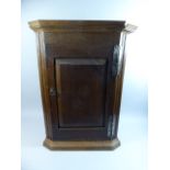 A Small Oak Corner Cabinet,