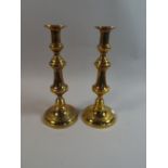 A Pair of Victorian Tall Brass Candle Sticks with Pushers,