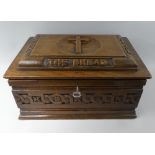 A Carved Oak Bible Box 'I Am The Bread Of Life'. Iron Carrying Rings Circa 1900. 44cms Wide.