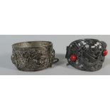 Two Base Metal Persian Bangles. One with Kukri Knife and Crescent Moon Mounts.