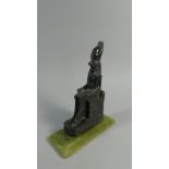 A Museum Replica of a Seated Egyptian Figure on an Onyx Base.