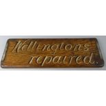 A Vintage Painted Oak Shop Advertising Sign 'Wellingtons Repaired' 42cms