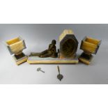 A French Art Deco Blonde and Grey Marble Clock Garniture with Bronzed Mount Depicting Reclining