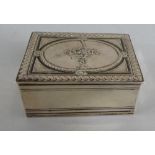 A Continental Silver Snuff Box. The Hinged Lid with Basket of Flowers in Relief.