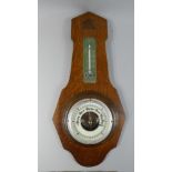 An Edwardian Oak Edwardian Aneroid Wall Barometer,