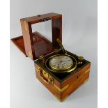 A 19th Century Double Hinged Mahogany and Brass Case which Opens to reveal Gimballed Ships Clock.