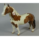 A Beswick Pinto Pony. Skewbald Gloss in Brown and White.