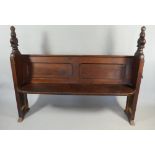 A Pair of Victorian Stained Pine Pews with Carved Finials.