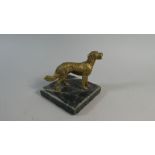 An Early 20th Century Austrian Gilt Bronze Dog on a Green Marble Base.