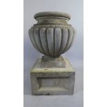 A Reconstituted Stone Campana Urn with Plinth Base.