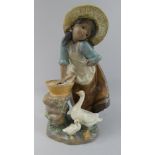 A Lladro Figure Group No.2216, Depicting Girl Washing Clothes Beside Geese, 24.