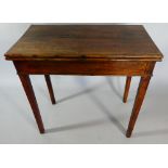 An 18th Century George III Country Made Walnut Tea Table with a Folding Top over Square Tapering