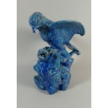 A Chinese Blue Glazed Figural Sculpture of Eagle Attacking a Monkey Like Beast.