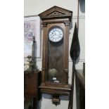 A Victorian Two Weight Kingwood Vienna Wall Clock.