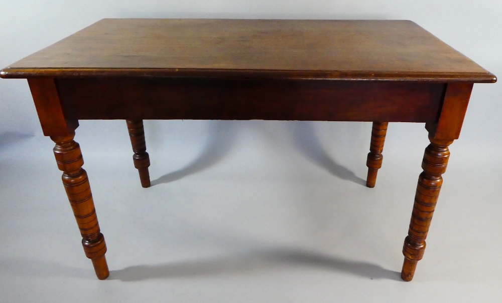 A Late Victorian/Edwardian Side Table on Turned Supports.