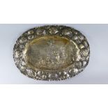 An Early Continental White Metal Platter. Wavy Rim Decorated with Pomegranate Garland.