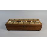 An Early 19th Century Rosewood Games Box.. The Top with an Inlaid Cribbage Board.