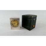A Moroccan Green Leather Cased Miniature Silver Travel Clock (Working Order) The Metal Dial with