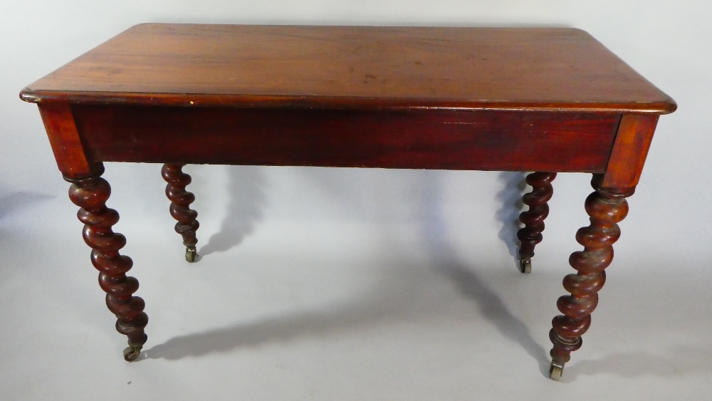 A Victorian Mahogany Rectangular Side Table with Barley Twist Supports.