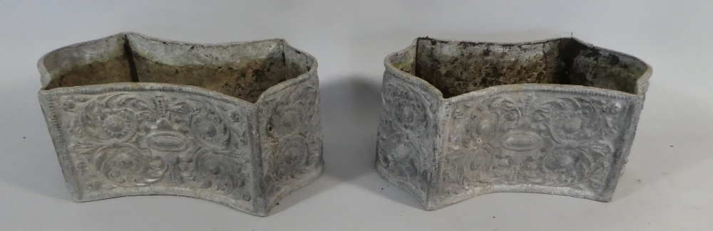 A Pair of Lead Garden Planters with Embossed Decoration.