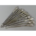 A Collection of Eleven Silver Mounted Button Hooks