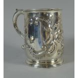 An Early Silver Tankard (Hallmark Rubbed) Repousse Work Depicting Floral Sprays to Cartouche Frames.